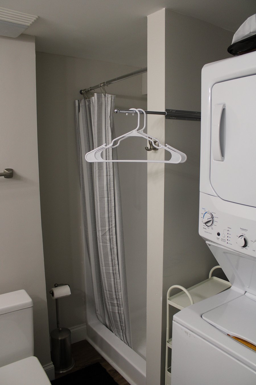 Shower and clothes hanging bar