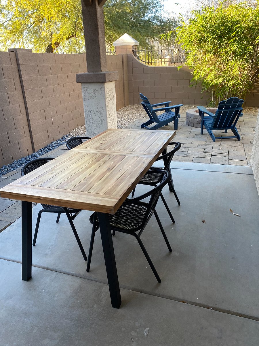 Outdoor patio, firepit and chairs. Lemon and orange trees.