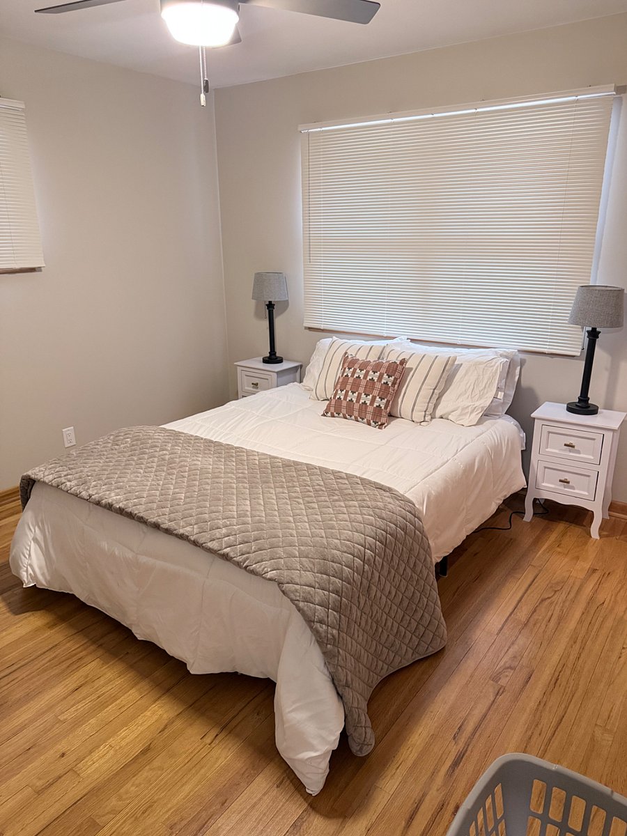 Queen sized bed with fresh linens