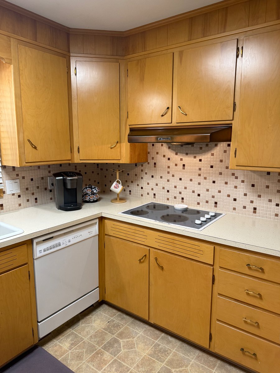 Cooktop and coffee maker and ample storage spaces.