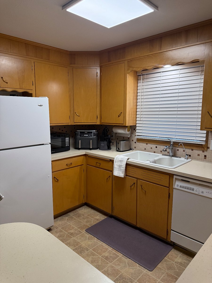Fully stocked eat-in kitchen with convenient appliances.