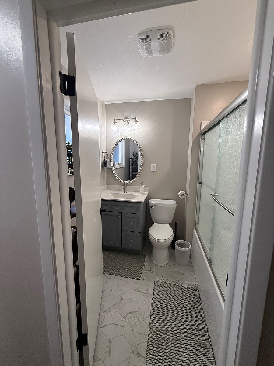 Private bathroom with tub and shower