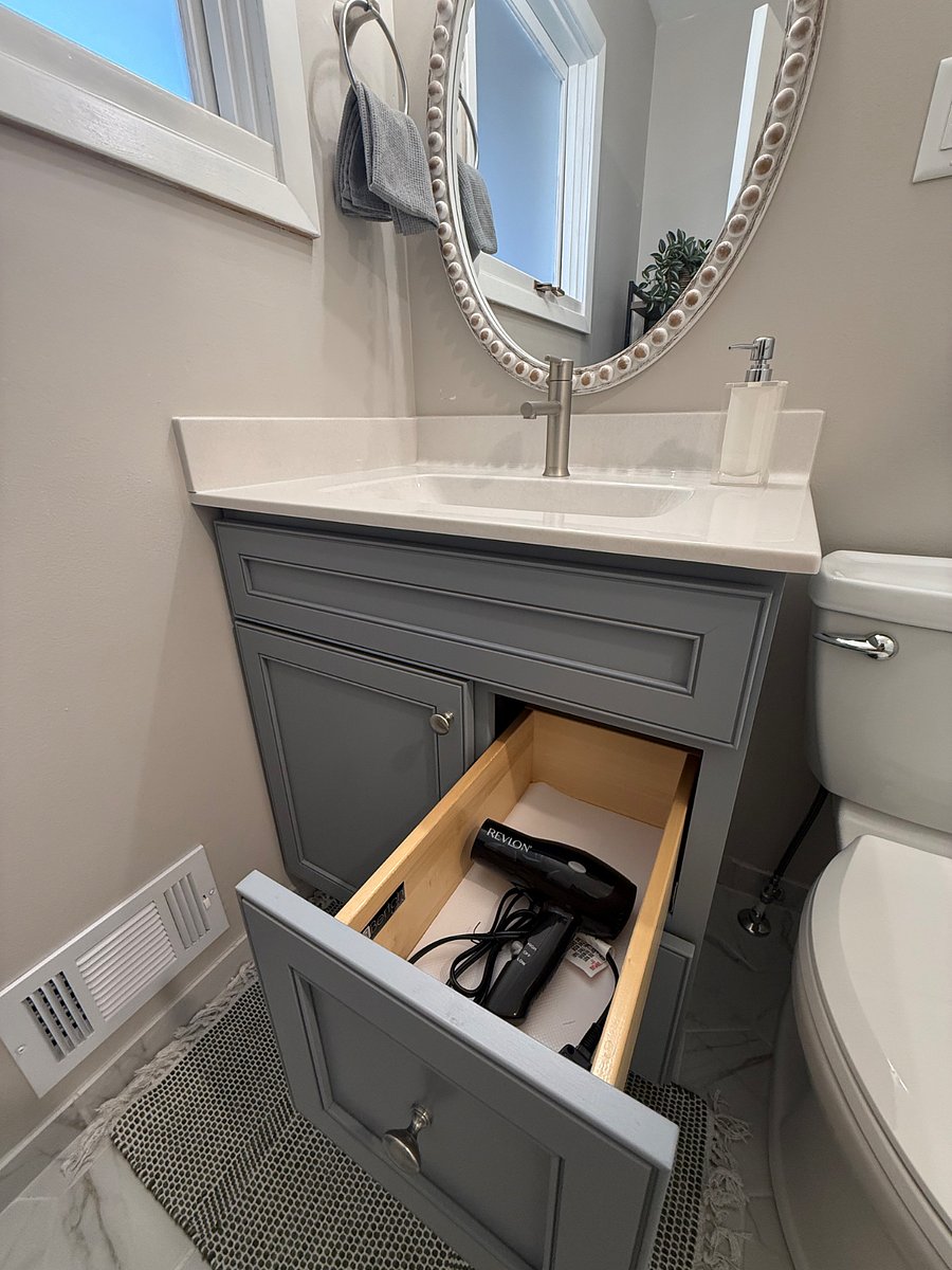 Hair dryer and ample storage space in private bathroom
