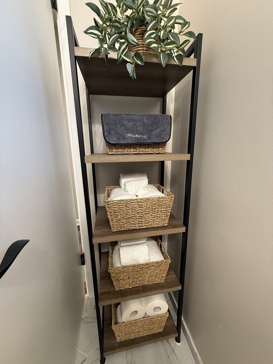 Ample storage and supplies in private bathroom.