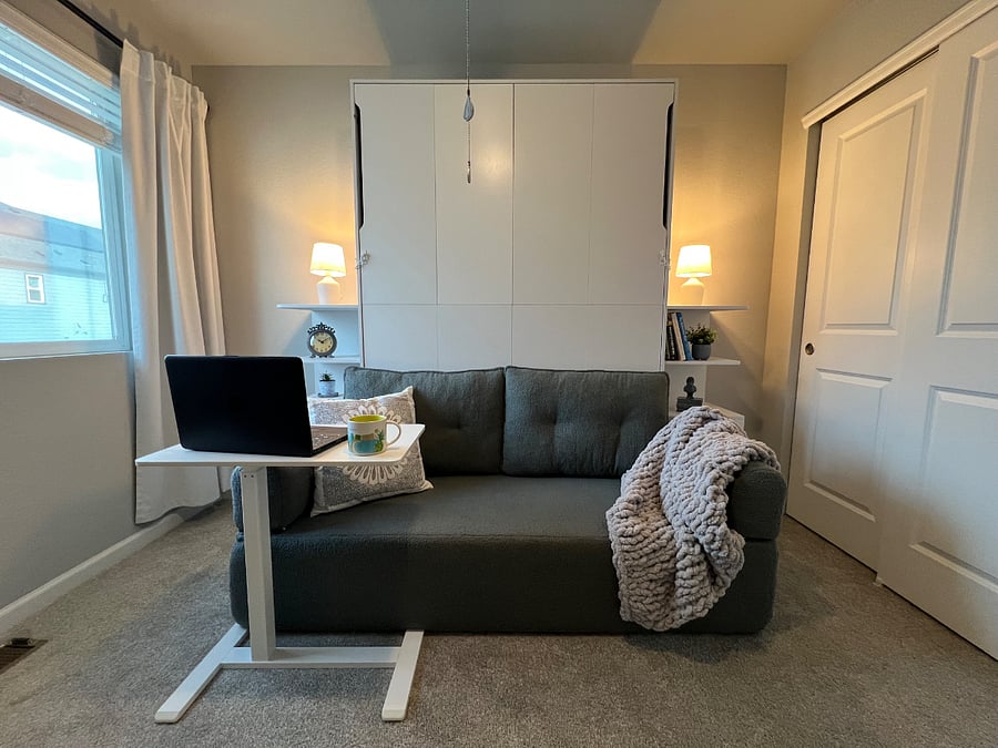 Mobile adjustable sitting or standing desk for when work needs to be done.