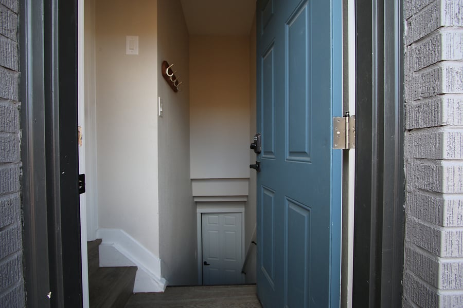 This photo shows the private entrance and hallway that leads downstairs to the basement unit.