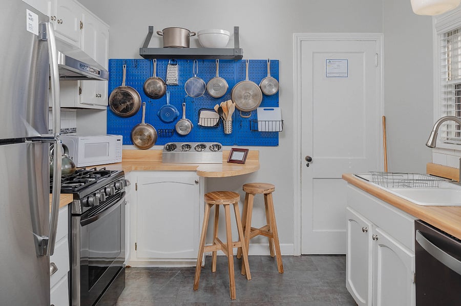 Fully equipped kitchen with high power gas range and exhaust hood, dishwasher, all pots/pans/serviceware