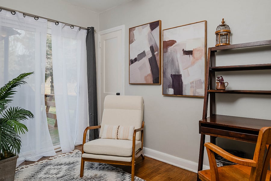 Dedicated office/workspace with patio door overlooking the backyard