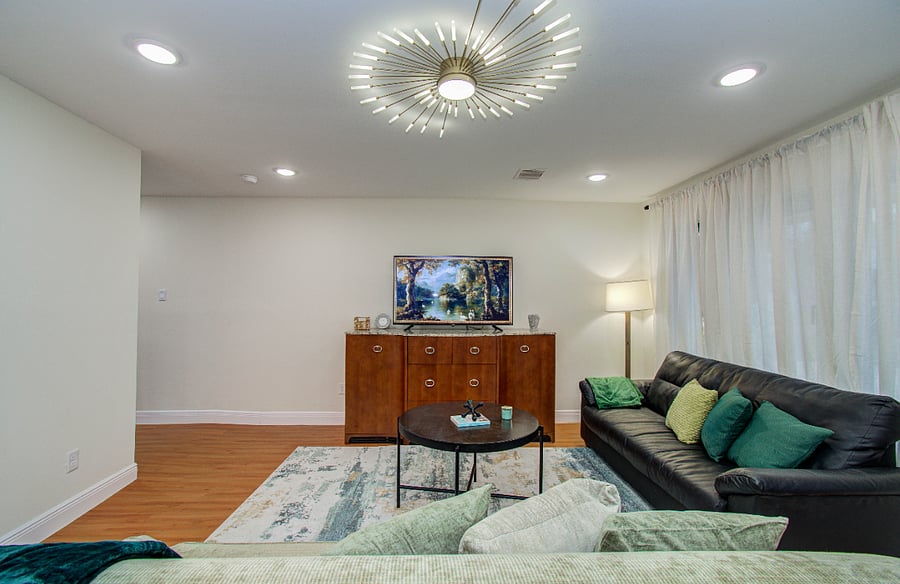 Large living area with 2 comfortable couches and smart TV