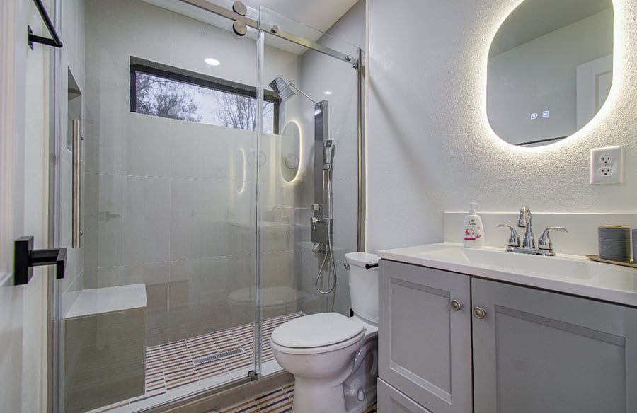 Bathroom with rain shower panel, bench, LED mirror 