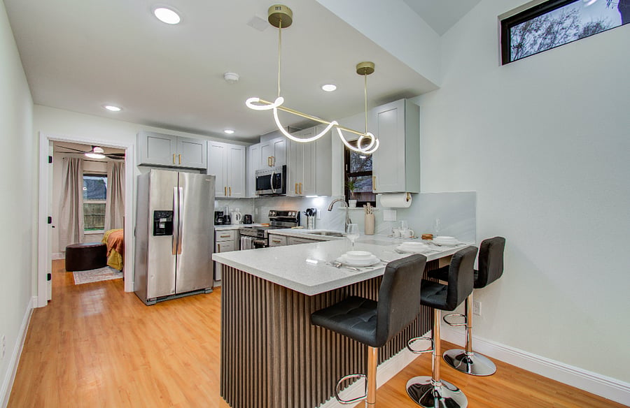 Kitchen with Quartz countertop and full size appliance