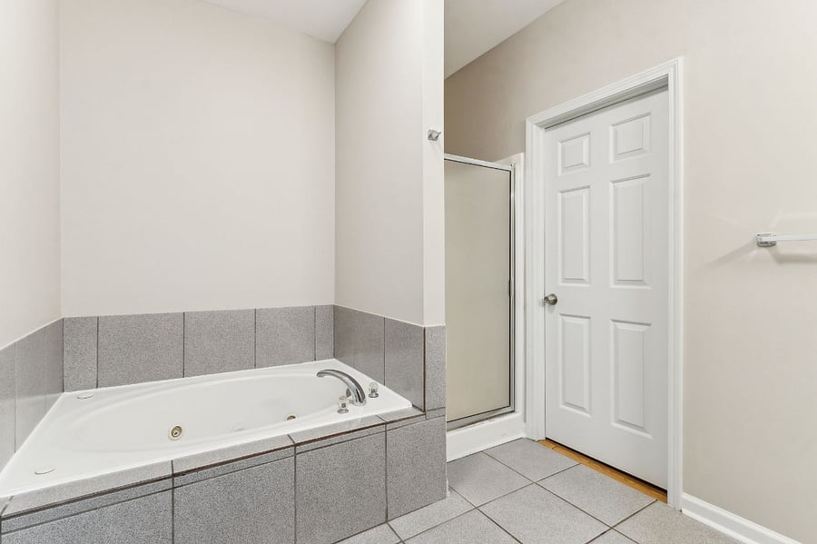 En suite bathroom with garden tub and separate shower