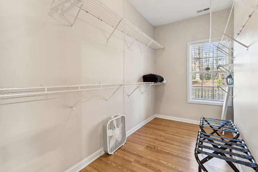 Large walk in closet in primary first floor bedroom