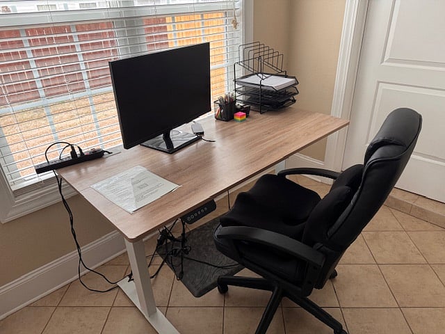 Work Station complete with external monitor and adjustable desk. 