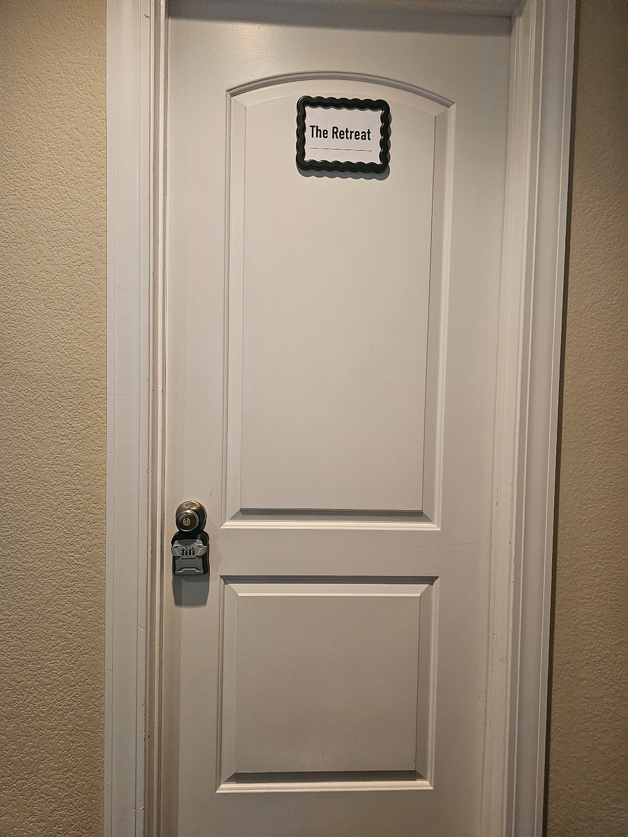 Private bedroom door with lock and lock box. 