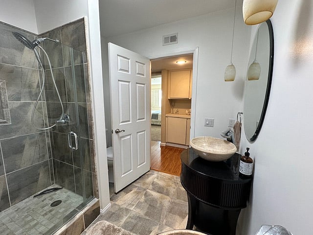 Private bath directly across hallway from bedroom