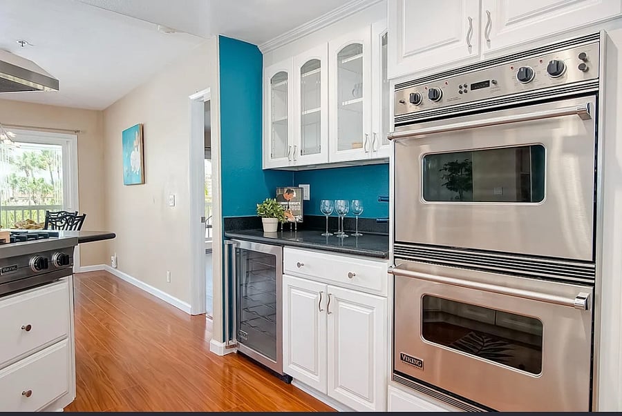 Viking double ovens and glass front cabinetry.