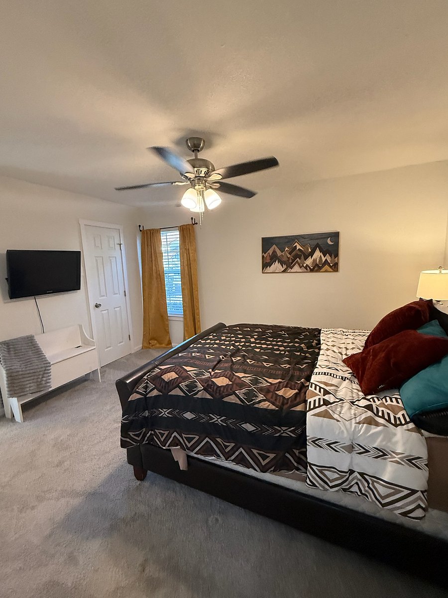 Large private bedroom with Queen sized bed, 2 nightstands, 32" Smart Roku TV and master full bathroom
