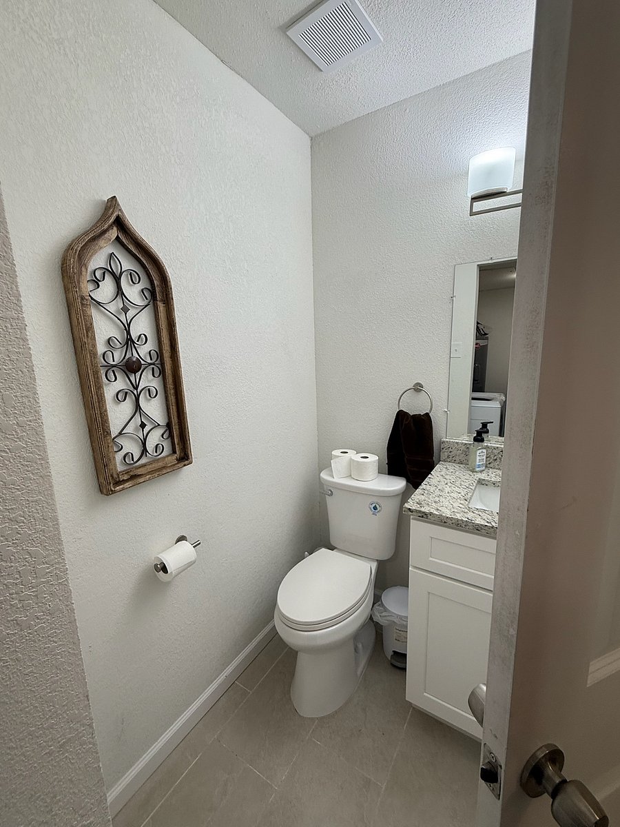 Guest 1/2 bathroom (off dining area and connected to laundry room)