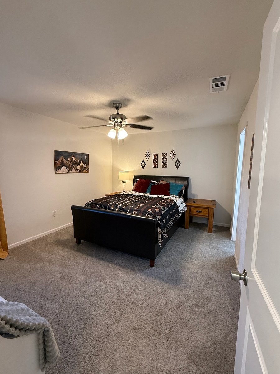 Large private bedroom with Queen sized bed, 2 nightstands, 32" Smart Roku TV and master full bathroom