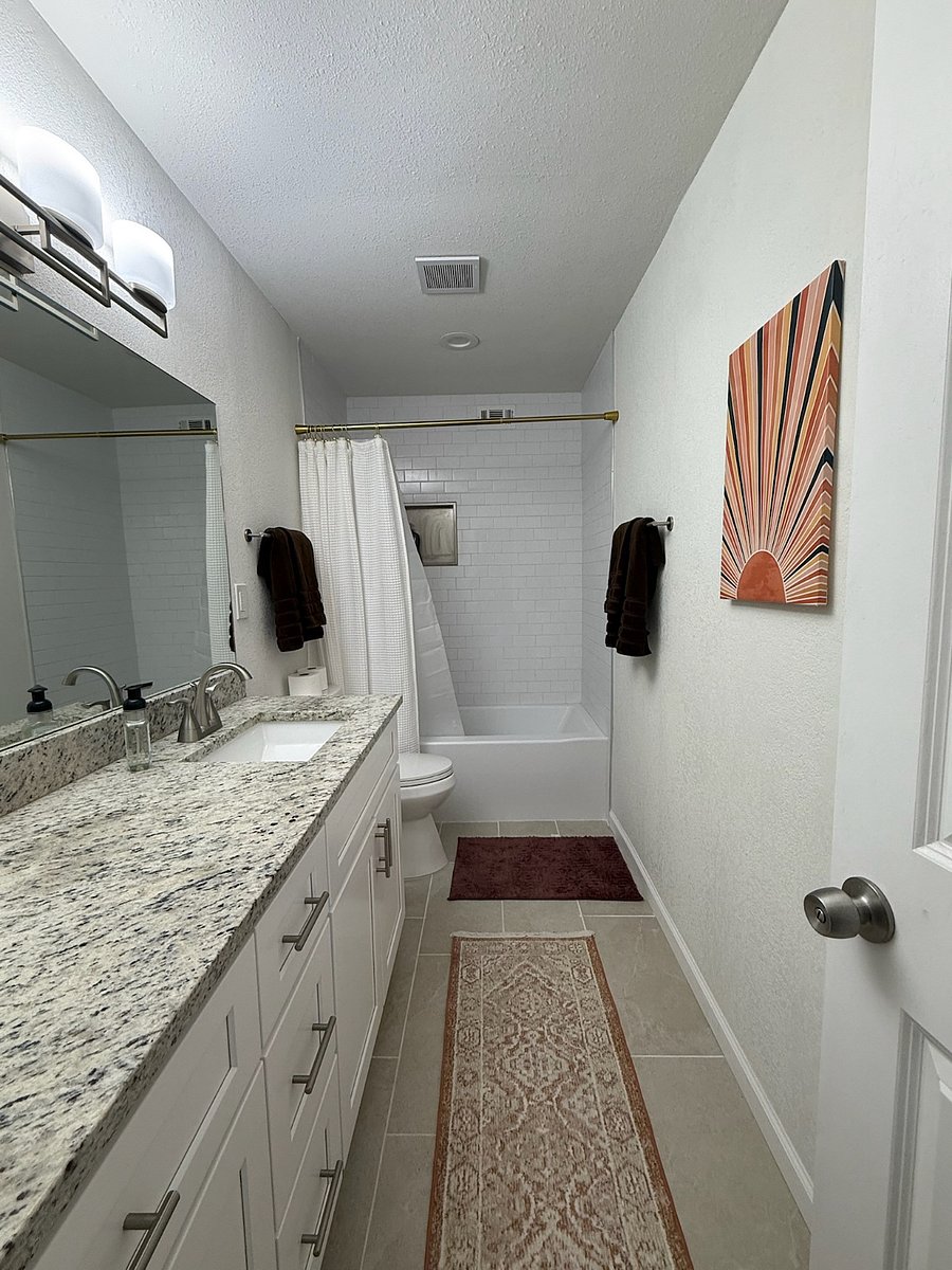 Private full master bathroom with tub and shower