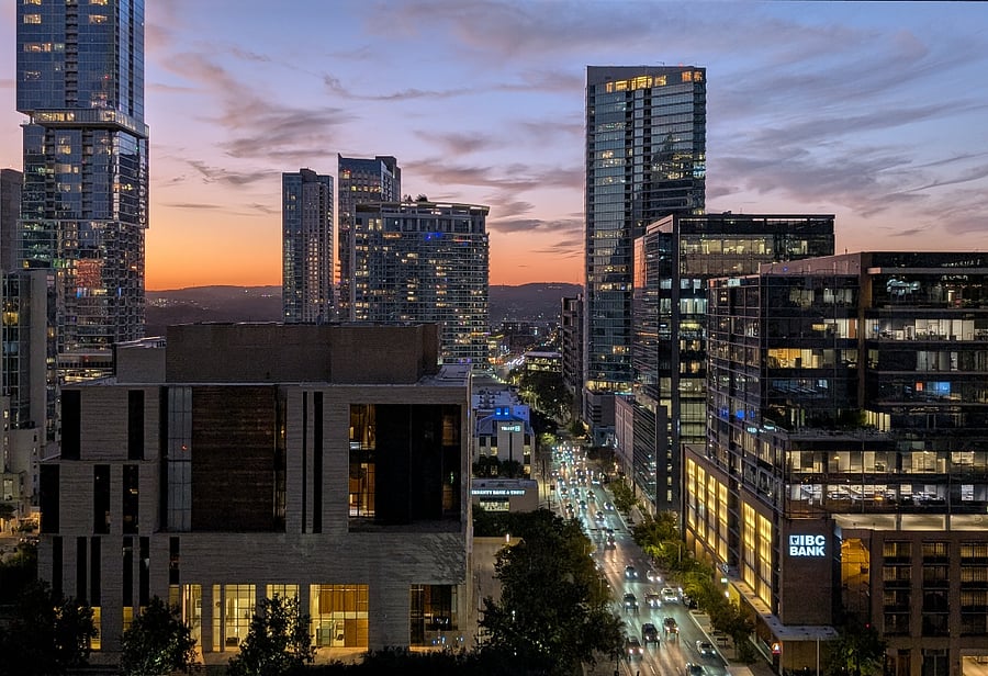sunset view from building amenity rooftop pool deck
