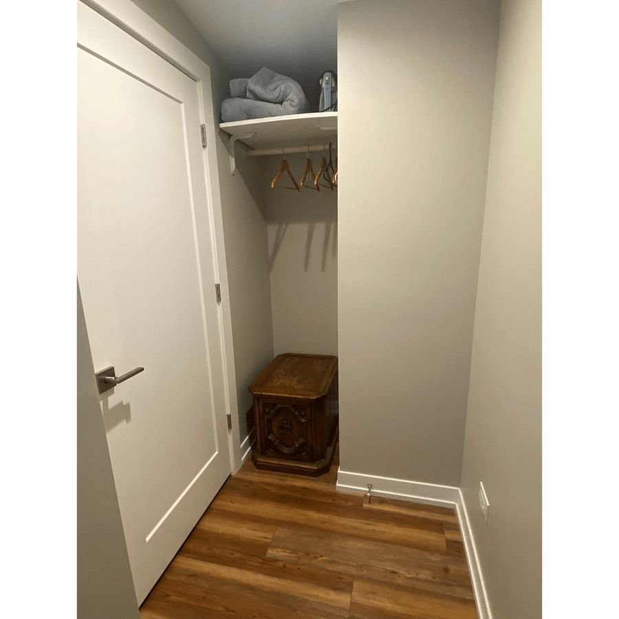 Common area hallway and closet alcove storage, located between bathroom and bedroom