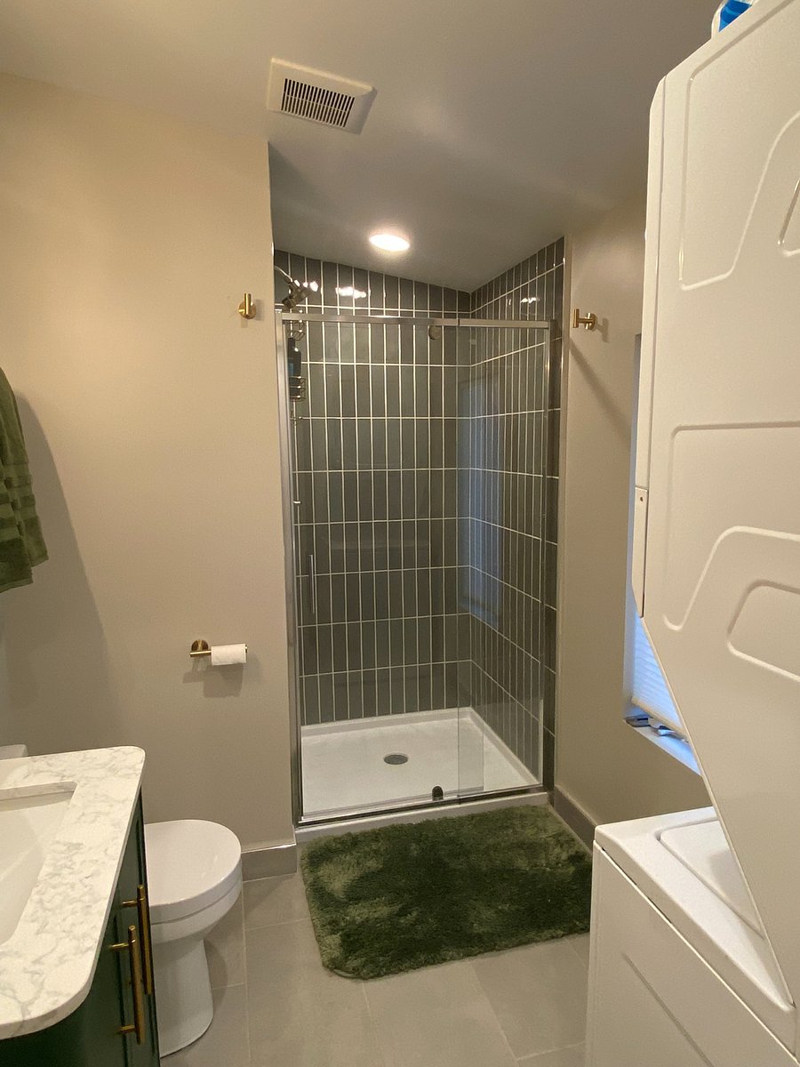 Bathroom. Walk-in shower with floor to ceiling tile