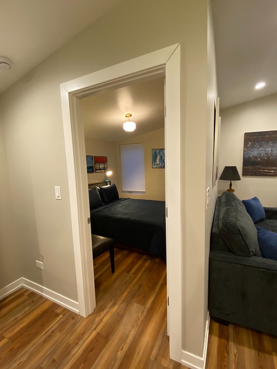 Bedroom. Bedframe has headboard with integral tabletop storage, and provides (4) storage drawers beneath the bedframe