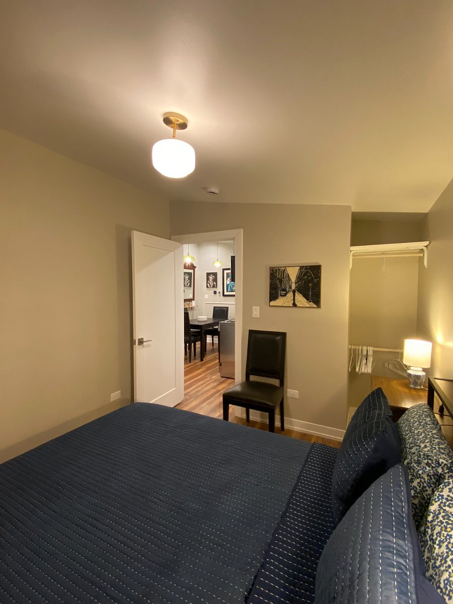 Bedroom. Bedframe has headboard with integral tabletop storage, and provides (4) storage drawers beneath the bedframe