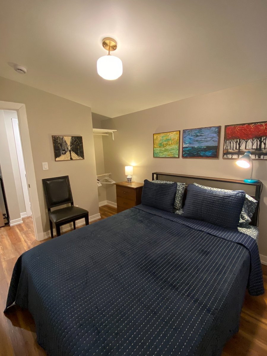 Bedroom. Bedframe has headboard with integral tabletop storage, and provides (4) storage drawers beneath the bedframe