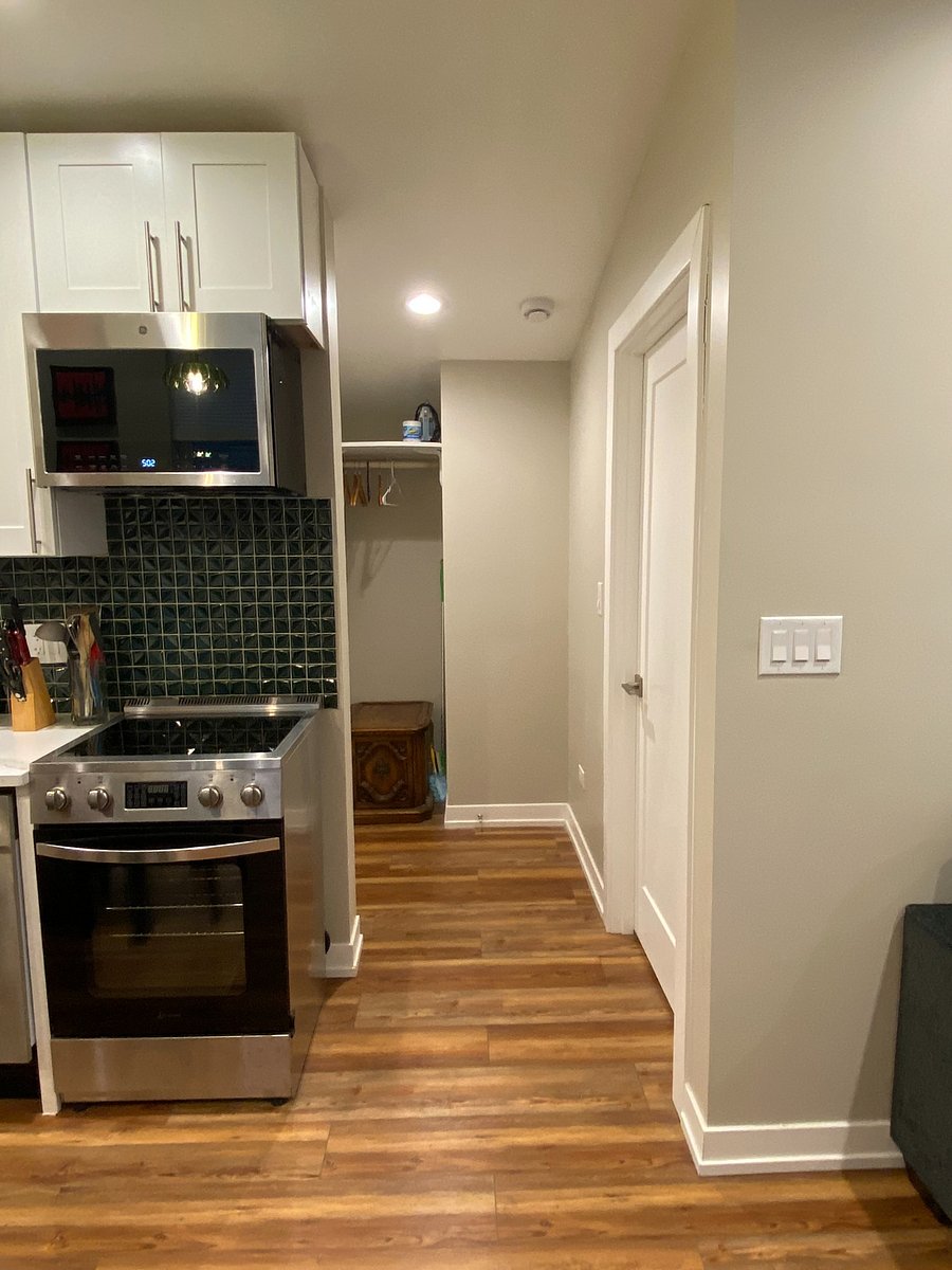 Common area hallway and closet alcove storage, located between bathroom and bedroom