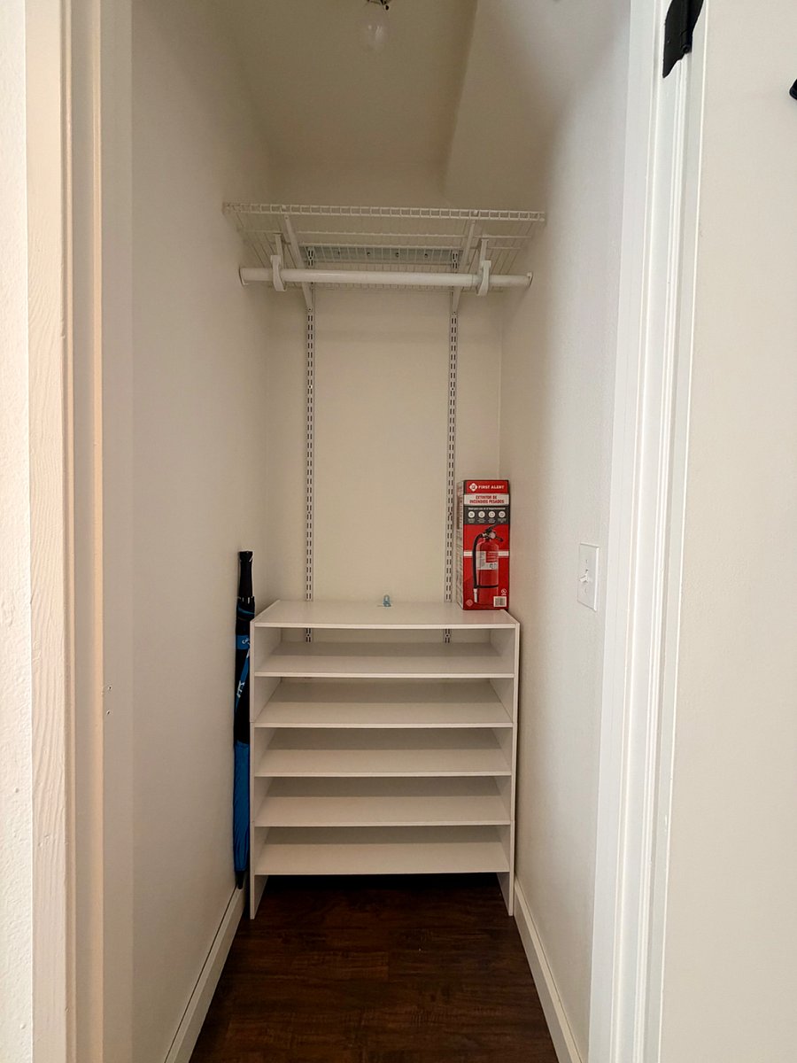 Convenient storage area with vacuum and essential.