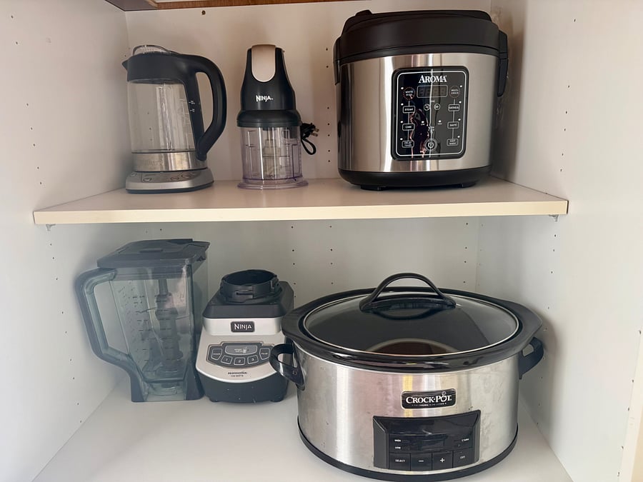 Fully equipped kitchen with blender, food processor, rice cooker, and slow cooker,  perfect for home-cooked meals during your stay.