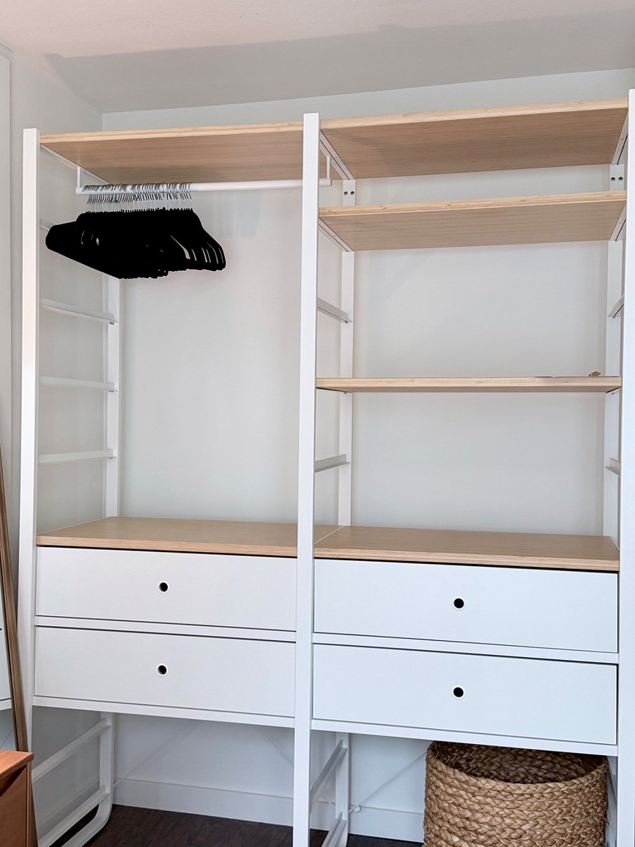 Spacious closet with shelving, drawers, and hanging space to keep belongings organized during your stay.