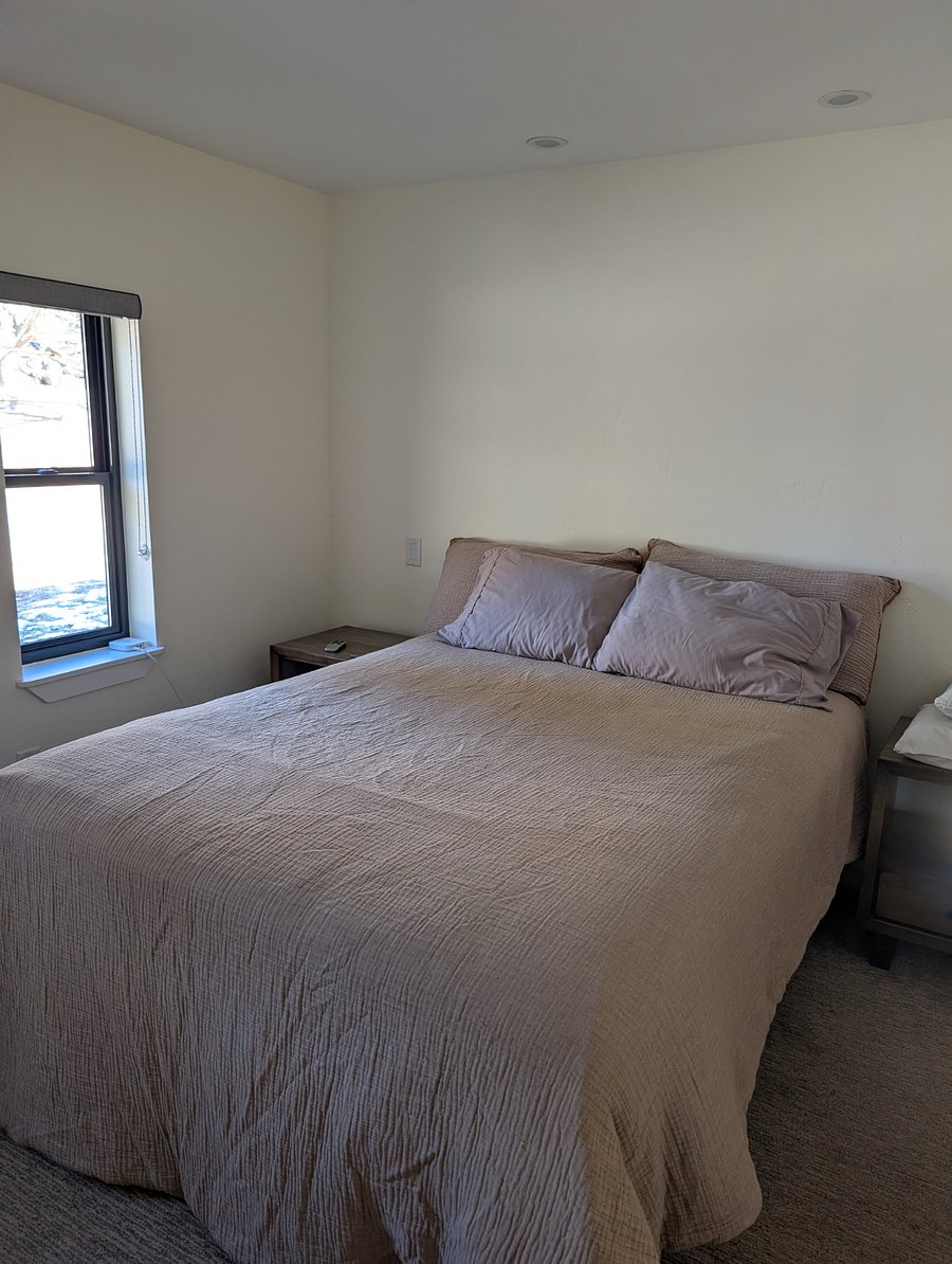 Spacious bedroom with reading nook.