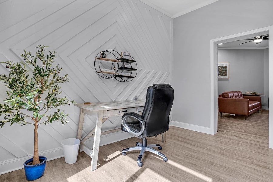 The 5th bedroom has a large executive desk and chair set up, and we can add a bed if needed. This is also a convenient nursery with a full-size baby bed and changing station if needed.