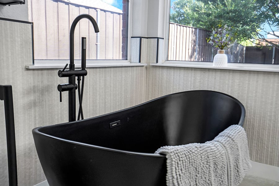 Spa tub in primary bathroom. Windows are now opaque glass :>
