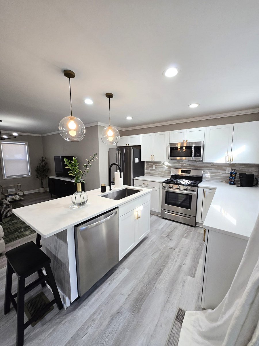 The kitchen has plates, glasses, silverware, pots/pans, kitchen utensils, and a nespresso coffee machine with pods.