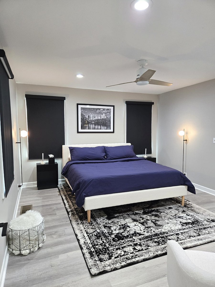 Master bedroom with California king bed and seating area.