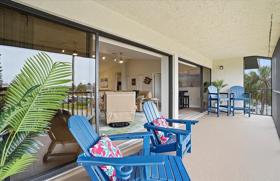 Large screened lanai with 2 sets of sliders open to living area