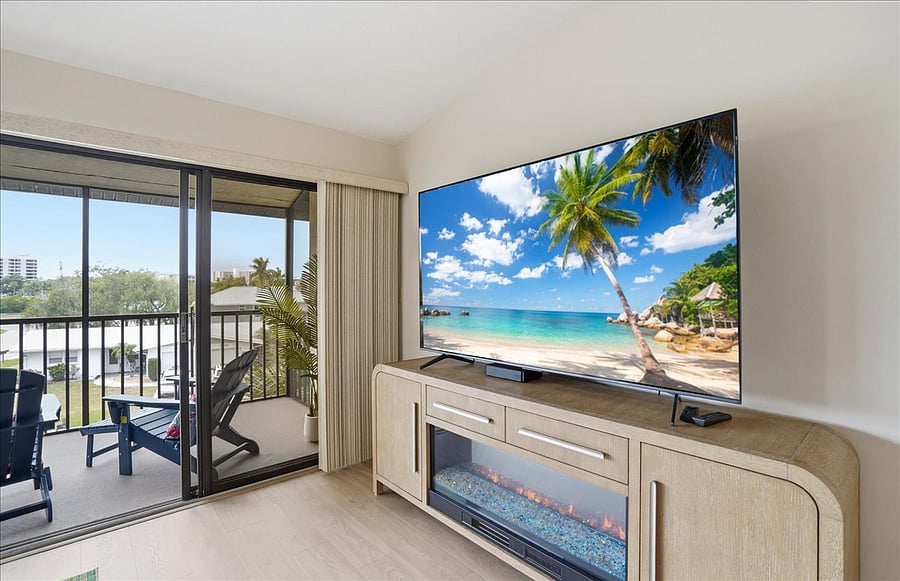 Large smart TV on top of electric fireplace