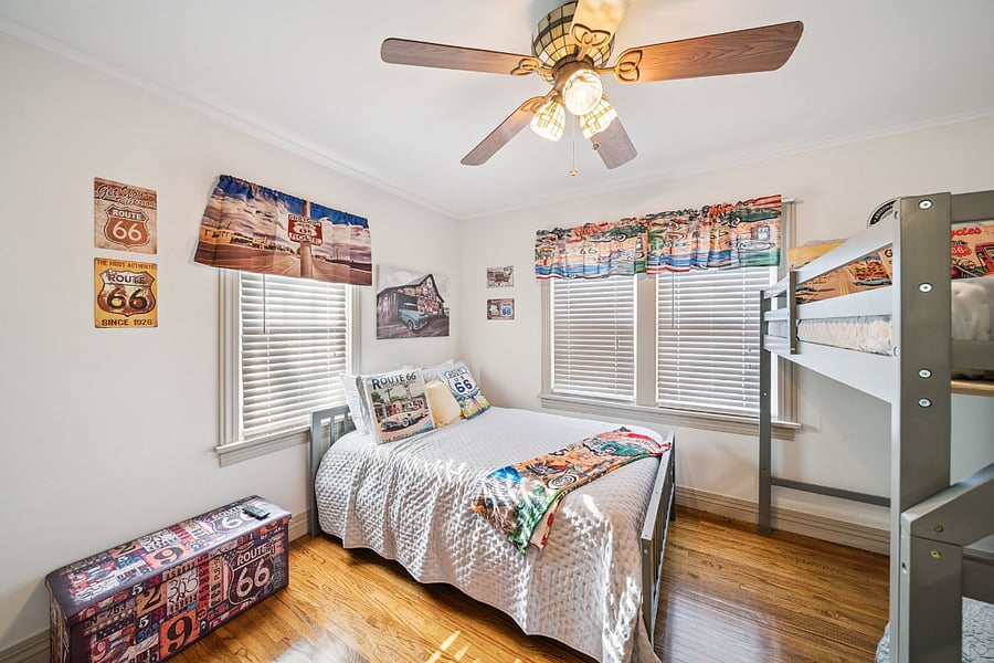 Bedroom #2 is decorated in a fun Route 66 theme, paying tribute to the rich history of America's "Mother Road." Located just three blocks from Historic Route 66, this room celebrates one of Tulsa's most iconic landmarks.
The bedroom features a full-size bed with a twin loft bed, making it ideal for families, friends, or additional guests. Beautiful original hardwood floors add warmth and character, while the themed dcor creates a unique and memorable stay that reflects the home's historic surroundings.