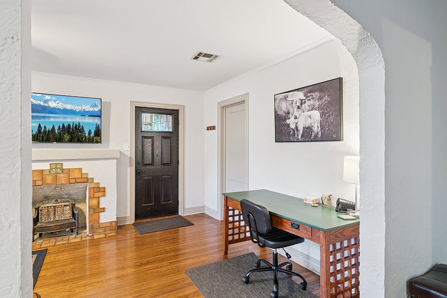 A dedicated workstation is conveniently located in the living room, offering a comfortable desk and chair for guests who work remotely, attend virtual meetings, or need a quiet place to study. Combined with high-speed Wi-Fi, this workspace makes the home an excellent choice for traveling professionals, business travelers, and extended stays.