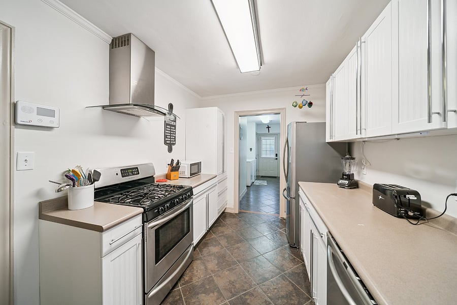 The updated kitchen combines modern conveniences with the charm of this historic home. It features a gas range with a single oven, ample countertop space, and a walk-in food pantry for storing groceries and kitchen essentials during your stay. Fully equipped with cookware, dishes, utensils, and small appliances, the kitchen has everything you need to prepare anything from a quick breakfast to a family dinner.