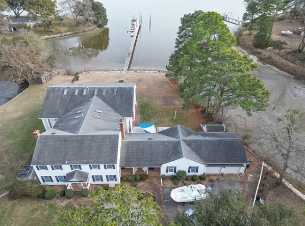 Aerial view of the lakefront home with private dock and direct water access.