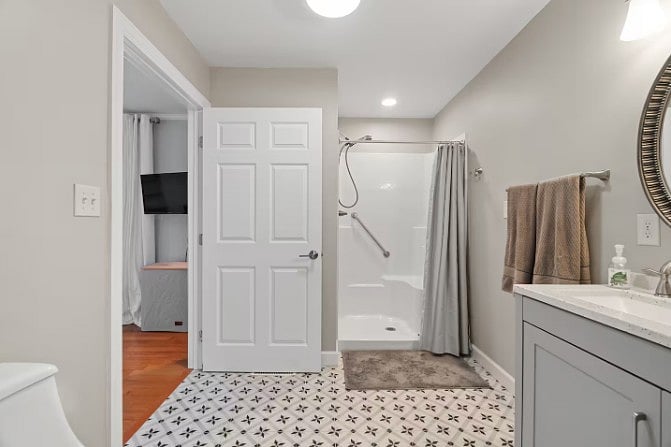 Clean and modern bathroom design with convenient room connections.
