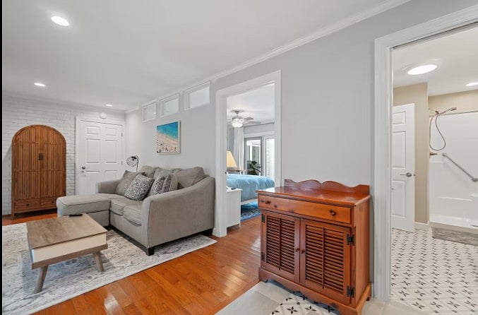 Comfortable seating area with a smart TV and peaceful outdoor views.