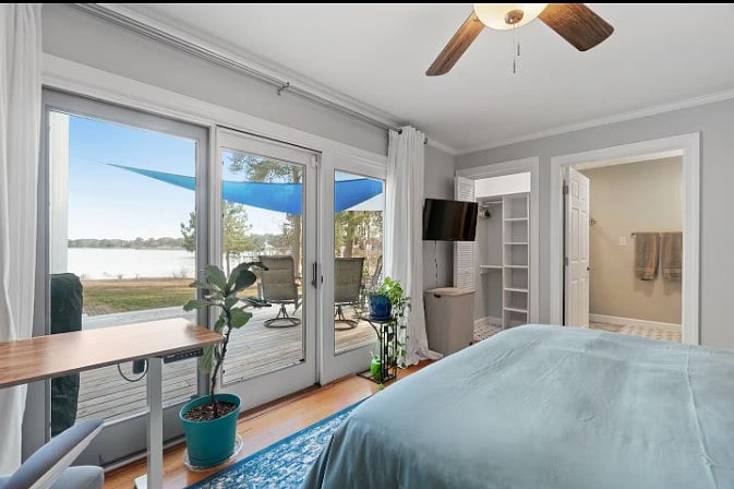 Comfortable queen-size sleeping area thoughtfully arranged to maximize space, comfort, and relaxation.