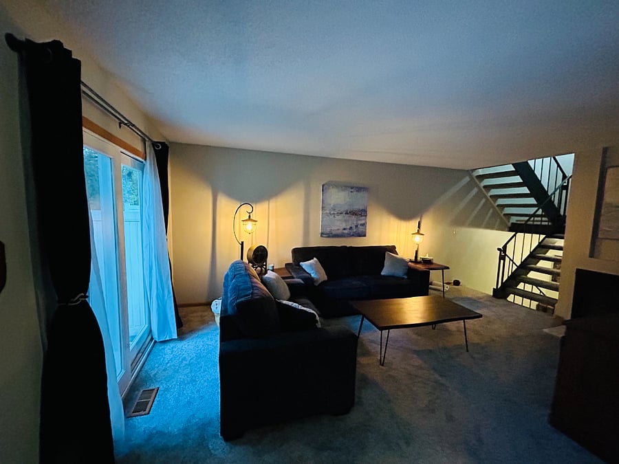Living room with stair visible